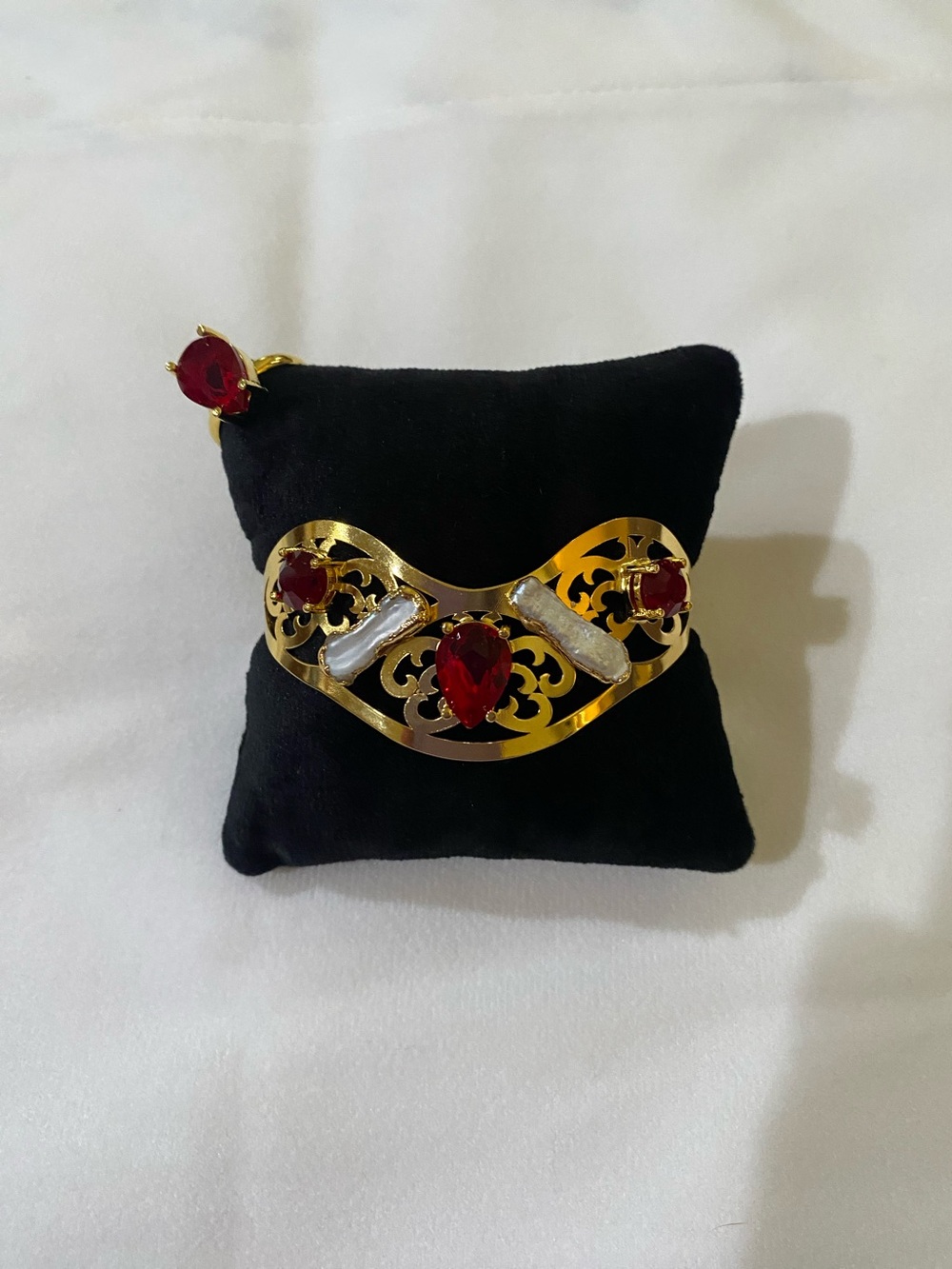 Gold-Tone Filigree Bracelet with Red Gem Accents